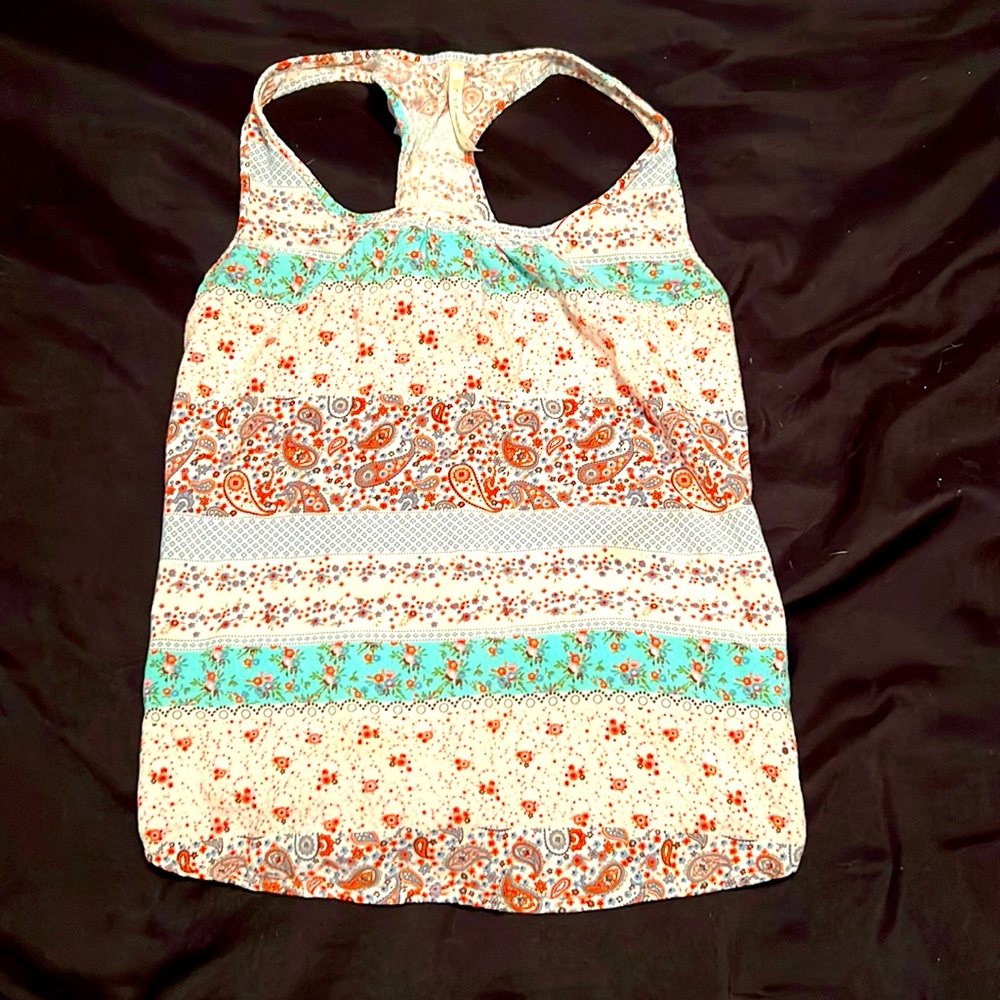 DNA couture tank with floral print and ruffle T back.